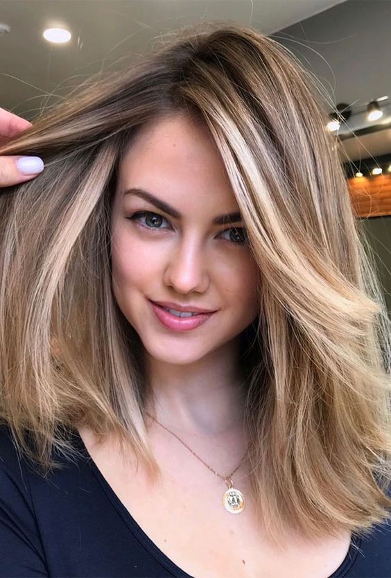 gorgeous blonde hair with a darker root, highlights and undertones is a very chic idea to rock