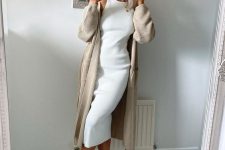 35 a white sleeveless midi dress, a tan long cardigan, white trainers for an airy and pretty spring look