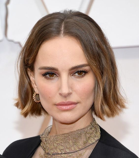 Natalie Portman wearing a beautiful brown boy bob with center parting and caramel touches and waves looks amazing