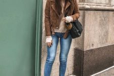With beige turtleneck, brown suede cropped jacket, black leather bag, skinny jeans and beige suede ankle boots