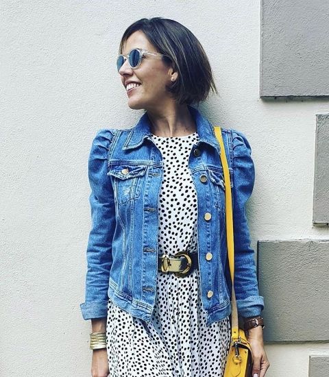 With black and white polka dot midi dress, belt, sunglasses and yellow leather bag