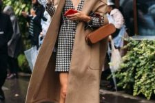With black and white printed button front mini dress, beige midi coat, brown bag and brown patent leather mid calf platform boots
