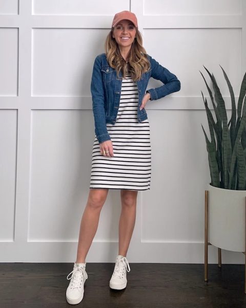 With black and white striped knee-length dress, denim jacket and white sneakers