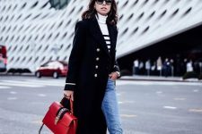 With black and white striped turtleneck sweater, black midi coat, sunglasses, red leather bag and cuffed jeans