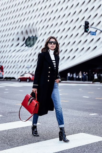 With black and white striped turtleneck sweater, black midi coat, sunglasses, red leather bag and cuffed jeans