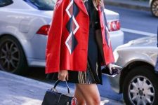 With blouse, pleated mini skirt, colorful jacket and black and red leather bag