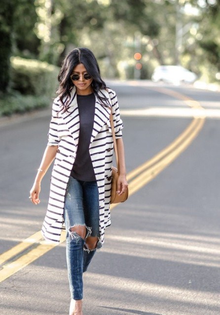 With dark gray t-shirt, brown leather bag, distressed skinny jeans, rounded sunglasses and white pumps