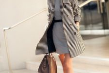 With gray mini dress, black belt, brown leather bag and beige embellished shoes