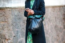 With green printed midi dress, midi coat and black leather tote bag