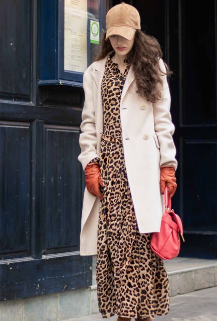 With leopard printed maxi dress, knee-length coat, orange leather gloves and hot pink leather bag