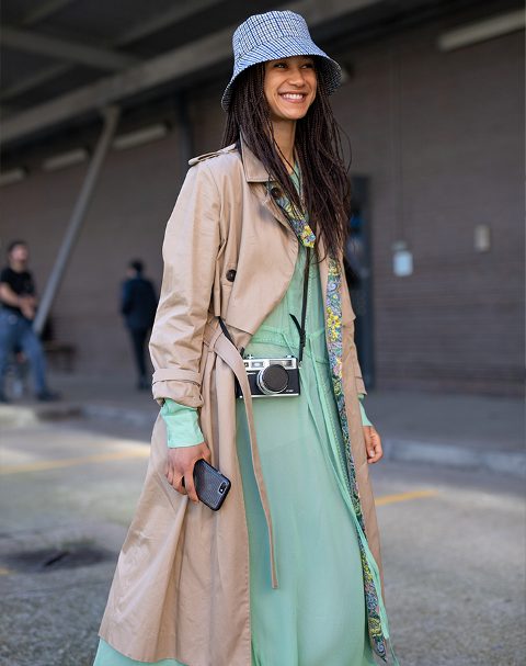 With mint green maxi dress and beige trench coat