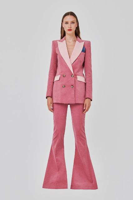 With pale pink corduroy flare trousers