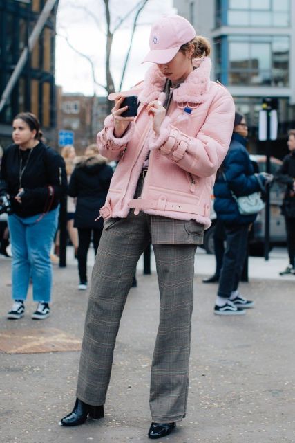With pale pink jacket, checked trousers, checked blazer and black leather high heel boots