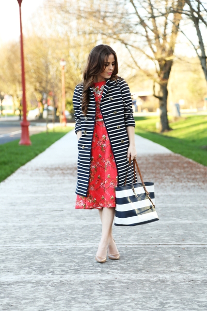 With red floral printed midi dress, golden belt, black and white striped tote bag and beige shoes