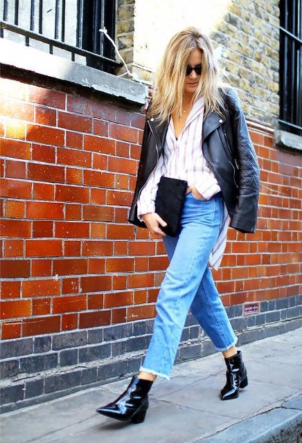 With striped loose button down shirt, black leather jacket, sunglasses, suede clutch and cropped jeans