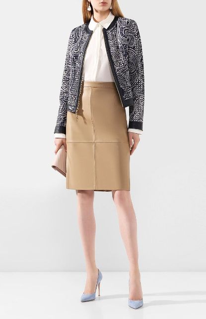With white button down blouse, black and white printed collarless jacket, beige leather clutch and light blue pumps