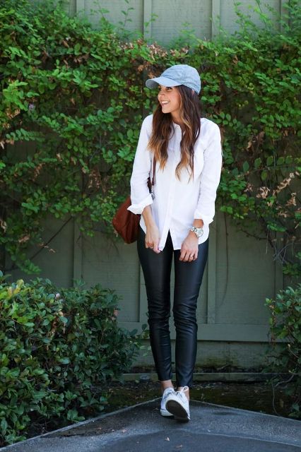 With white button down shirt, brown leather bag, black leather skinny pants and white flat shoes