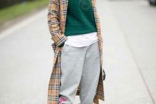 With white long shirt, emerald green sweater, gray loose jogger pants, white socks and printed ankle strap high heels