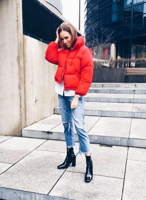 With white shirt, red puffer jacket and distressed jeans
