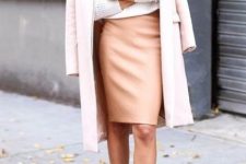 With white sweatshirt, pale pink midi coat, sunglasses and beige ankle strap high heels