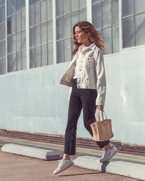 With white t shirt, dark gray cropped jeans, beige tote bag and white lace up flat shoes