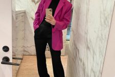 a black tee, black trousers, black mules and a fuchsia oversized blazer for a chic and bold spring work look