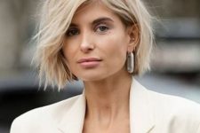 a chic fresh blonde bob with beach waves is a beautiful and textural take on a classic hairstyle