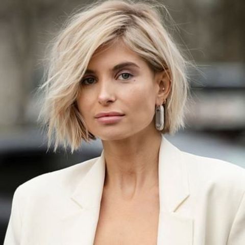 a chic fresh blonde bob with beach waves is a beautiful and textural take on a classic hairstyle