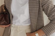 a lovely and easy spring work look with a white t-shirt, creamy jeans, a houndstooth print blazer, brown bag and statement necklaces