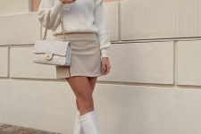 a neutral spring look with a ribbed jumper, a tan mini skirt, white chunky boots and a white bag