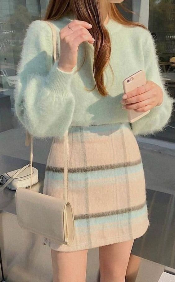 a pastel look with a light green fluffy jumper, a checked pastel mini skirt, a creamy crossbody bag
