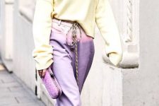 a pastel spring look with lilac pants, a pastel yellow sweater, white trainers, a lilac clutch is cool