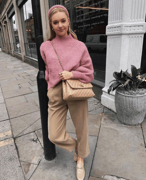 a pink ribbed sweater, camel high waisted pants, tan loafers, a tan bag for work and not only