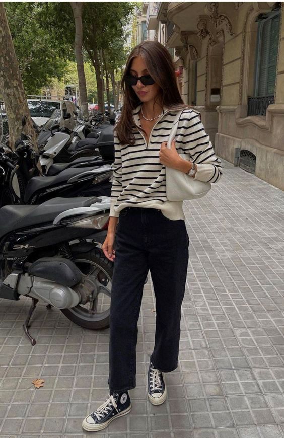a simple look with black jeans, a striped black and white long sleeve shirt, a white bag and black high top sneakers