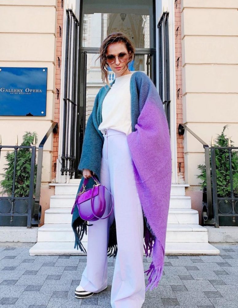a white t-shirt, lilac trousers, an ombre blue to purple cover up, a purple bag and platform shoes