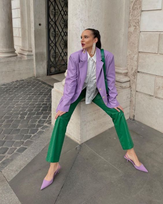 a bold work look for spring   a white shirt, a Very Peri oversized blazer, emerald leather pants, lilac slingbacks and an emerald bag