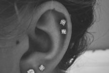 05 a refined ear look with a double helix piercing and a double lobe one, with all-matching stud earrings is a timeless idea