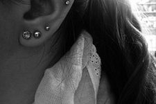 07 a triple lobe piercing and a double helix one with pretty studs are a timeless idea to rock, they look cool