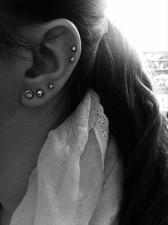 a triple lobe piercing and a double helix one with pretty studs are a timeless idea to rock, they look cool