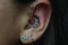 09 beautiful opal ear styling with a double lobe piercing, a daith piercing, a triple forward helix one, all done with matching studs and hoops