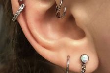 10 beautiful ear styling with a double helix piercing, with a stud and a hoop, with a double lobe piercing with creative boho earrings and a double forward helix piercing with hoops