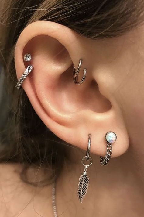 beautiful ear styling with a double helix piercing, with a stud and a hoop, with a double lobe piercing with creative boho earrings and a double forward helix piercing with hoops