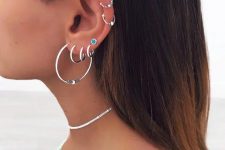 12 a boho look with stacked helix and stacked lobe piercings all done with bold and cool hoop earrings