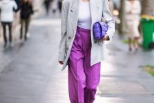 12 a work outfit with a white bodysuit, an oversized dove grey blazer, purple pants, a Very Peri bag and grey shoes