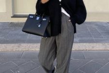 14 a white tee, a black cardigan, grey striped wideleg trousers, white trainers, a black tote for a chic look