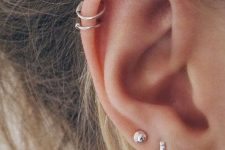 16 stacked lobe piecrings and a double helix one with mix and match minimalist earrings – stud and hoop ones