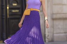 18 a lovely look with a light Very Peri sleeveless top, a Very Peri pleated midi skirt, leopard print shoes, a mustard belt and a waist bag