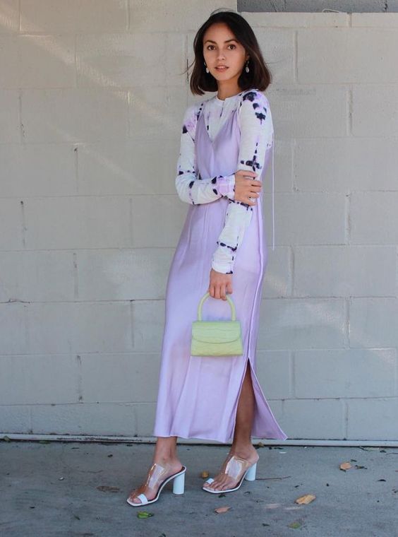 a delicate spring to summer look with a printed white top, a lilac slip midi dress, clear mules and a light green bag