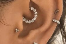 20 chic and glam ear styling with a stacked lobe piercing, two helix, a tragus and a daith one done with shiny rhinestone studs and hoops