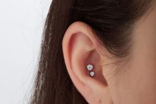25 a lovely and delicate double conch piercing done with matching but different in size rhinestone studs is amazing